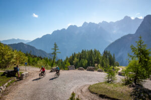 Cyclists pushing up the Vršič Pass, Slovenia.