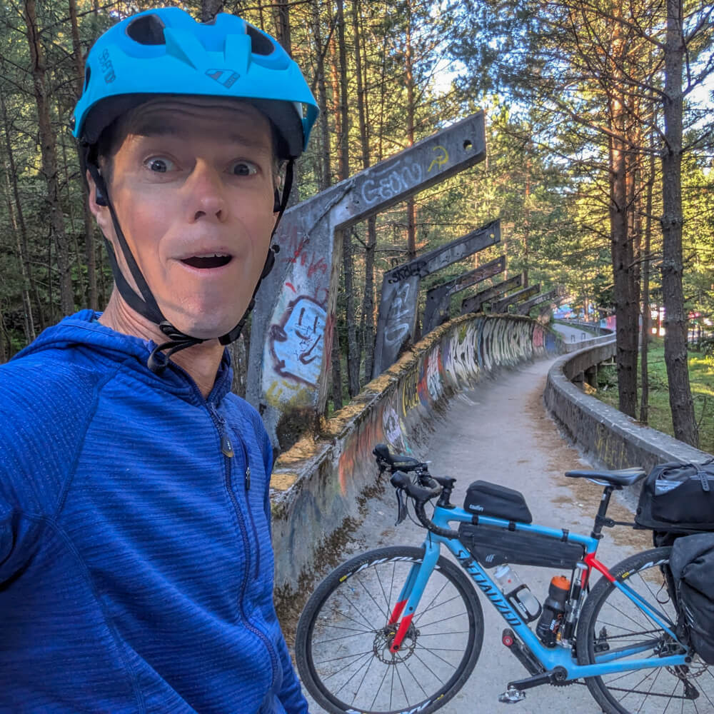 Solo cyclist Ben in Sarajevo bobsledge olympic track, Bosnia and Herzegovina.