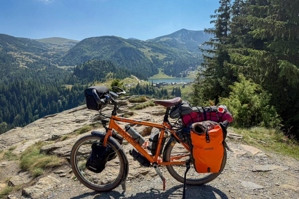 Travel touring bike loaded with bags in Prokoško lake, Bosnia and Herzegovina