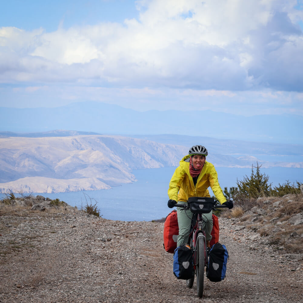A solo female bikepacker riding Trans Dinarica in Croatia.