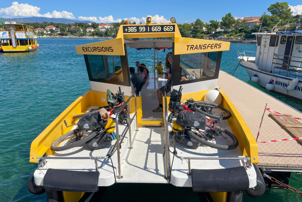 Taking the bikes on a small ferry.